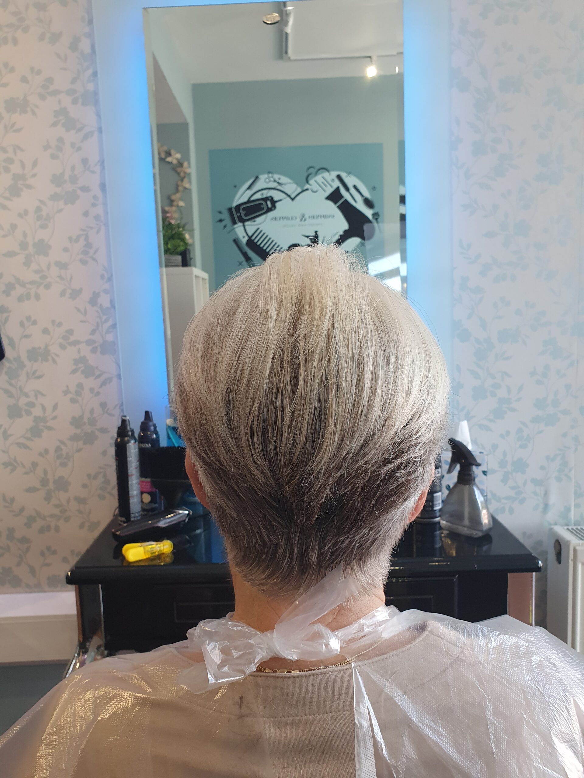 Women’s short haircut at Snippers and Clippers hair salon