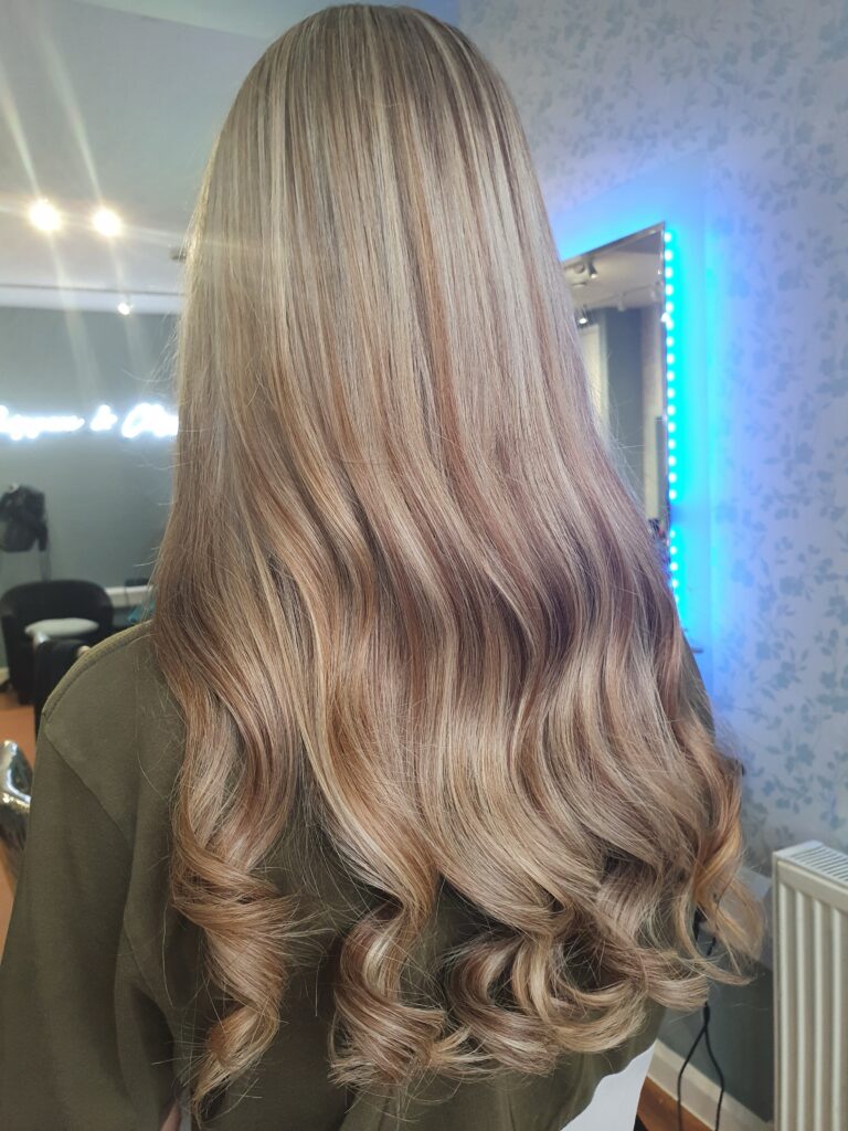 Long straight Ladies' haircut styled at Snippers and Clippers