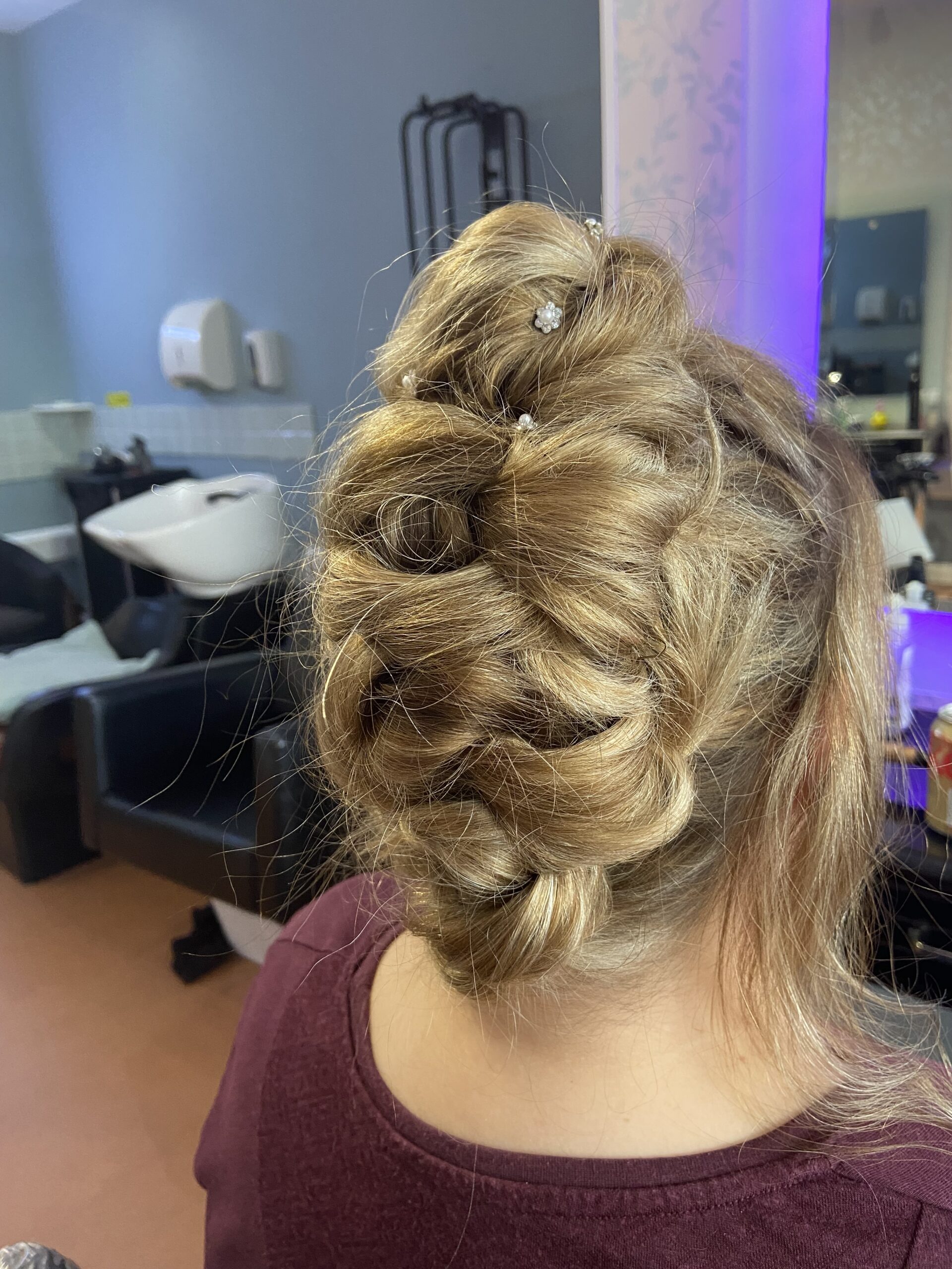 Hair styled elegantly in a professional updo
